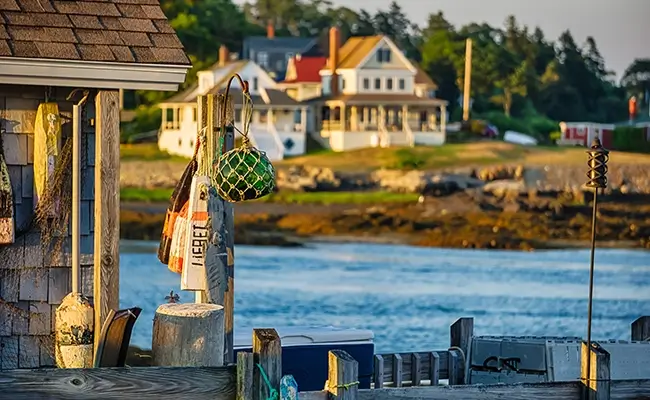 » Country Heritage Tours Harborside scene of building with buoys outside of it