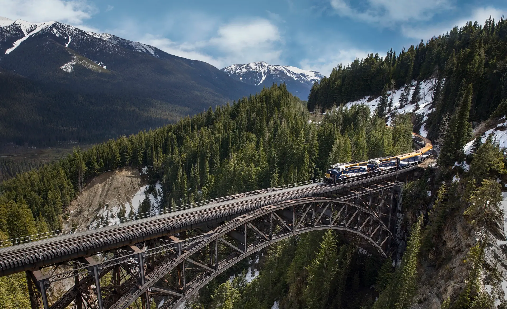 » Country Heritage Tours » Country Heritage Tours Passenger train traveling over a tall bridge in the Canadian Rockies