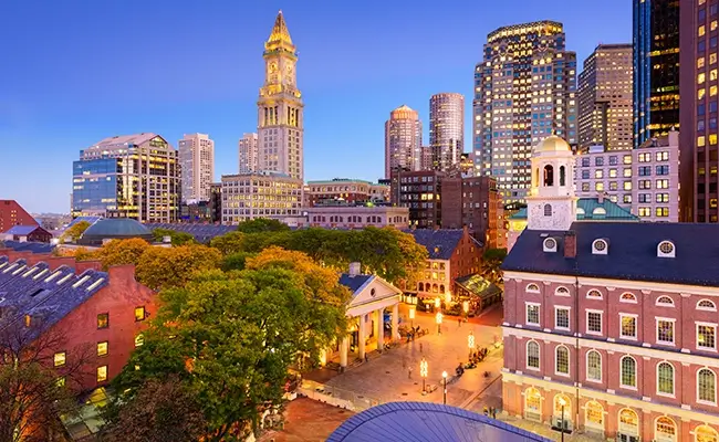 » Country Heritage Tours Boston city scape at night showing Faneuil Hall